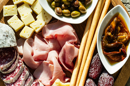 Italian snack and antipasti on a tray and red wine: prosciutto,, a Food & Drink Photo by IriGri