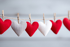 Colorful fabric hearts hanging on a, a Holiday Photo by MistyDay