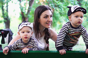 Mother with two sons in park