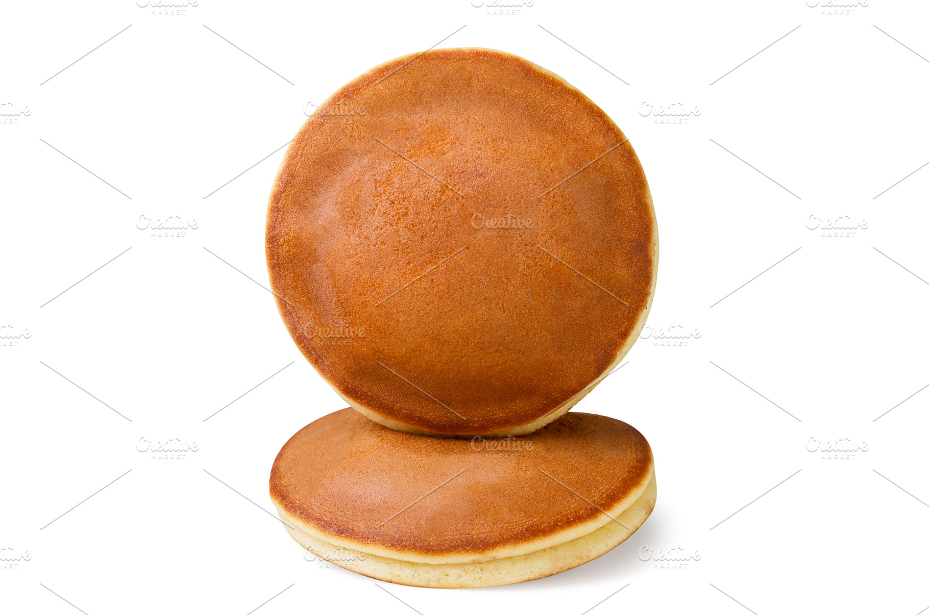 Two pancakes stand on top of each, a Food & Drink Photo by innakreativ