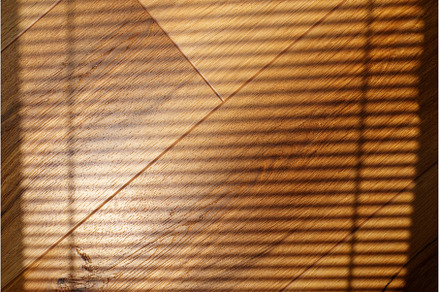 Shadows cast on hardwood flooring