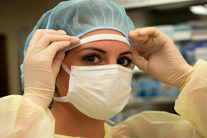 Nurse prepares for surgery by puttin, a Photo by Iftikhar Alam