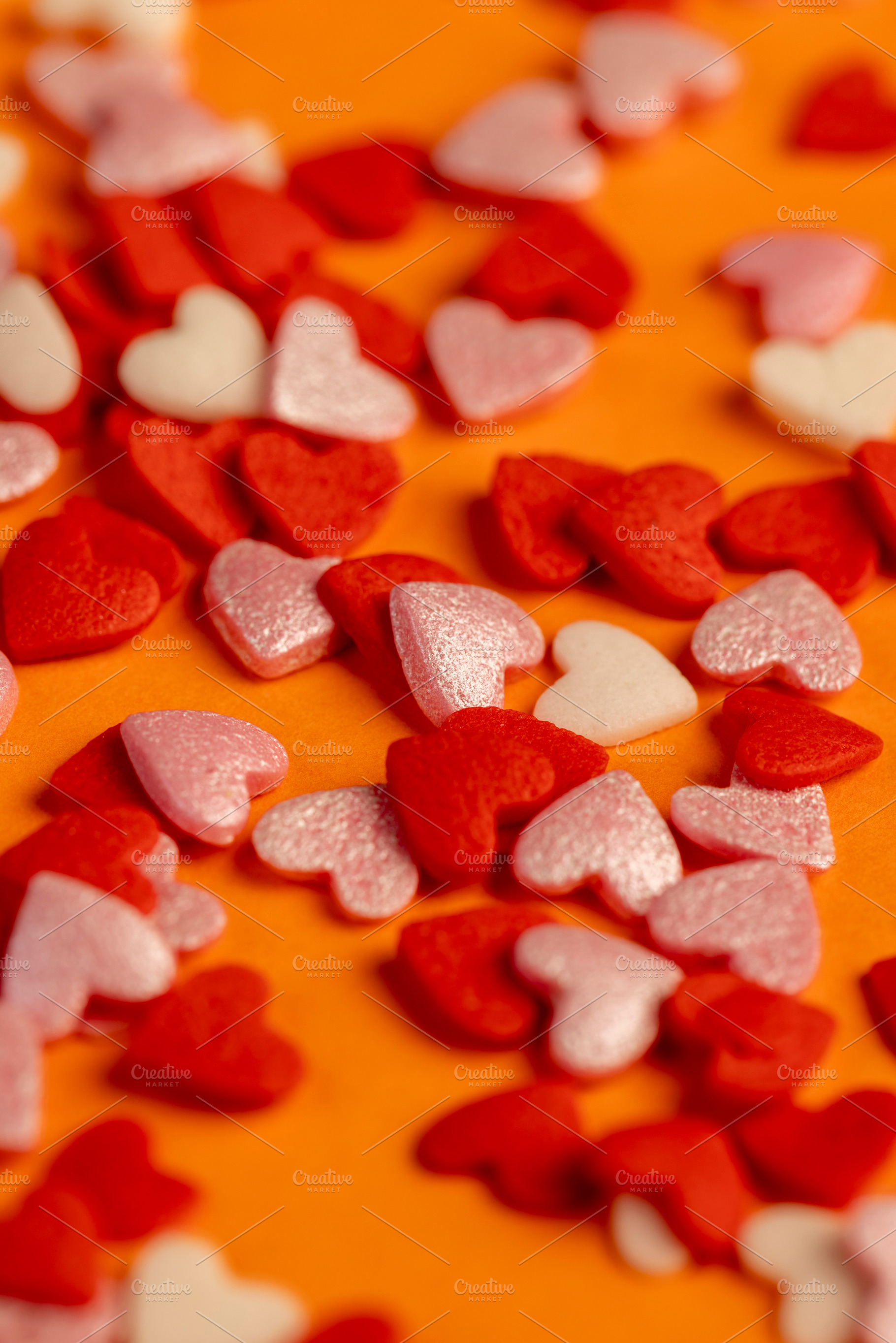 candy hearts made of sugar, candies are used to decorate pastries close up, a Photo by rsoollAI