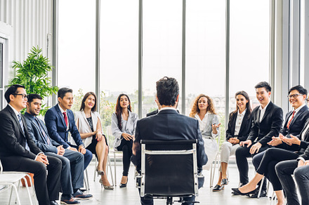 Businessman coach speaker presentation and discussing meeting st, a Person Photo by Art_Photo