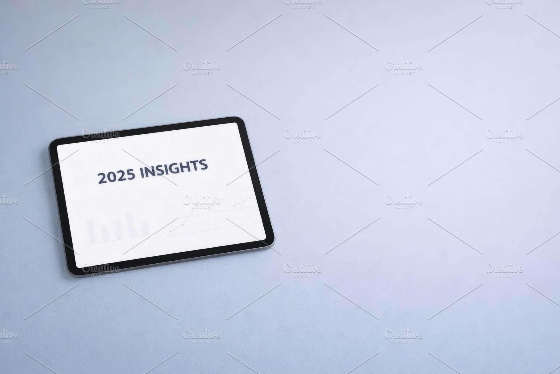 Tablet displaying 2025 insights conc, a Photo by Dvoevnore photos