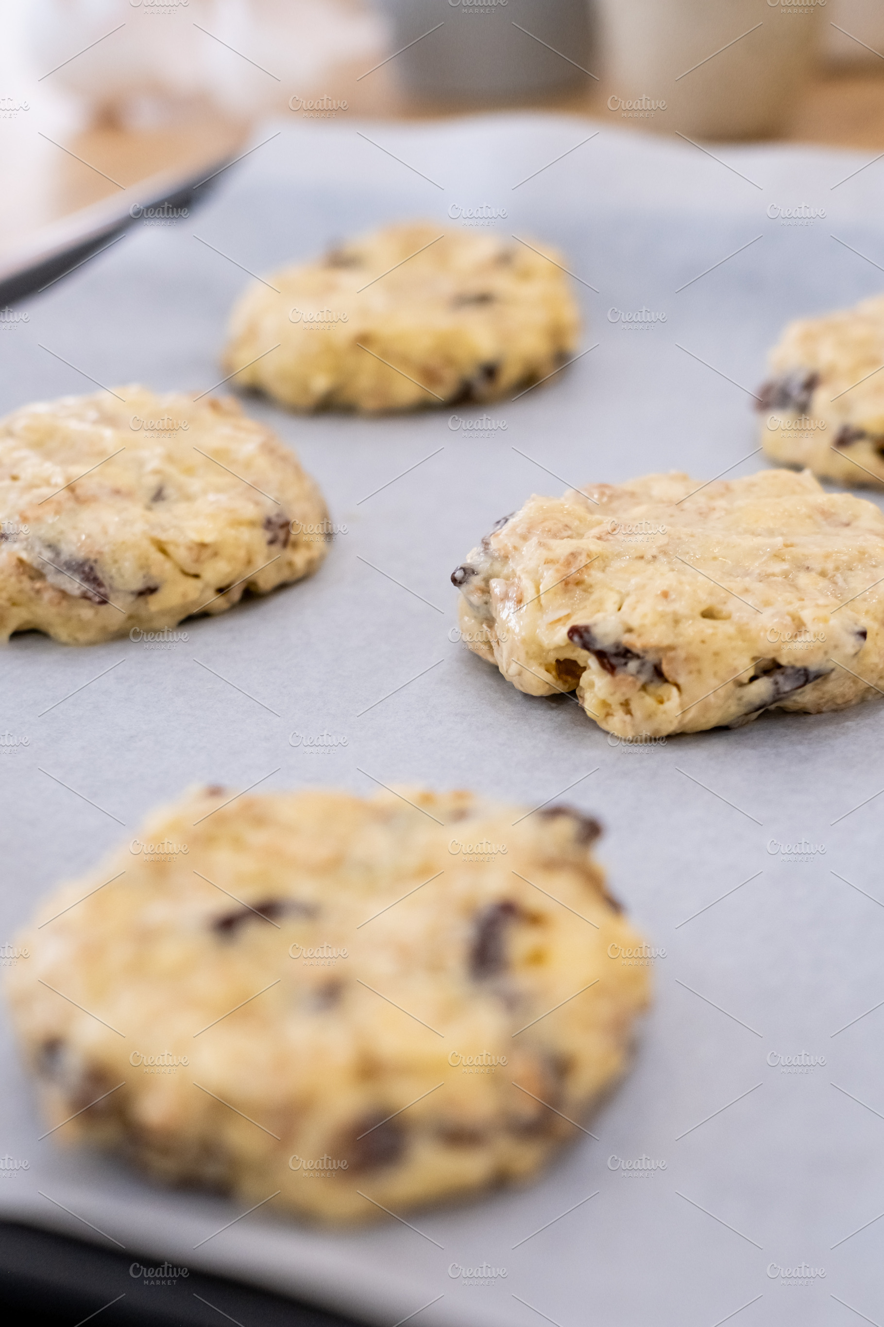 Oatmeal cookie homemade treat dough baking tray, a Food & Drink Photo by Photo Drive Studio