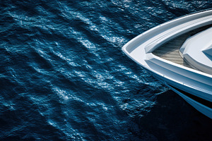 Yacht gliding on blue water surface, a Photo by Beautiful things