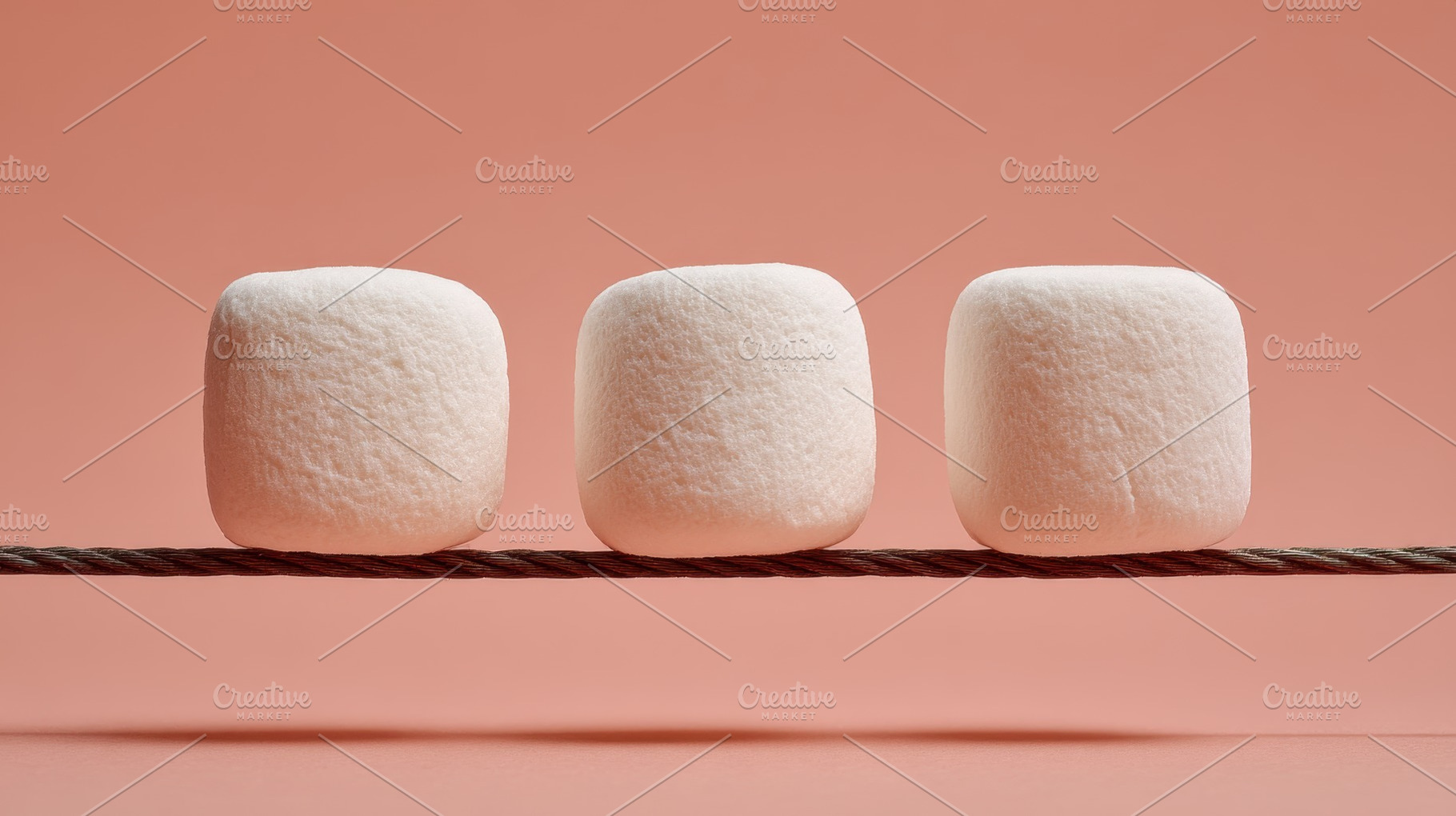 Marshmallows on a string display, a Photo by Beautiful things