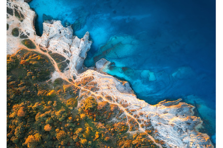 Aerial view of blue sea, rocks in, a Nature Photo by den-belitsky