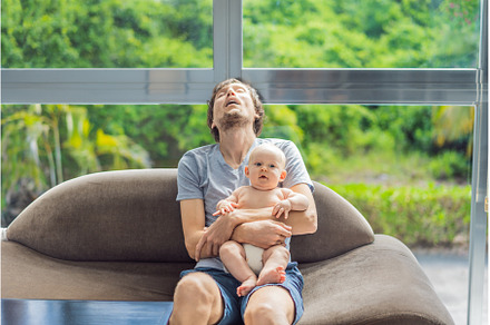 An exhausted father falls asleep on, a Person Photo by Elizaveta Galitskaya