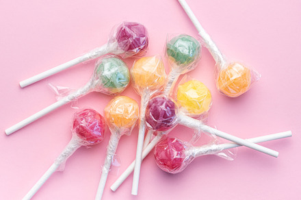 Sweet lollipops on pink background, a Food & Drink Photo by Olena Rudo