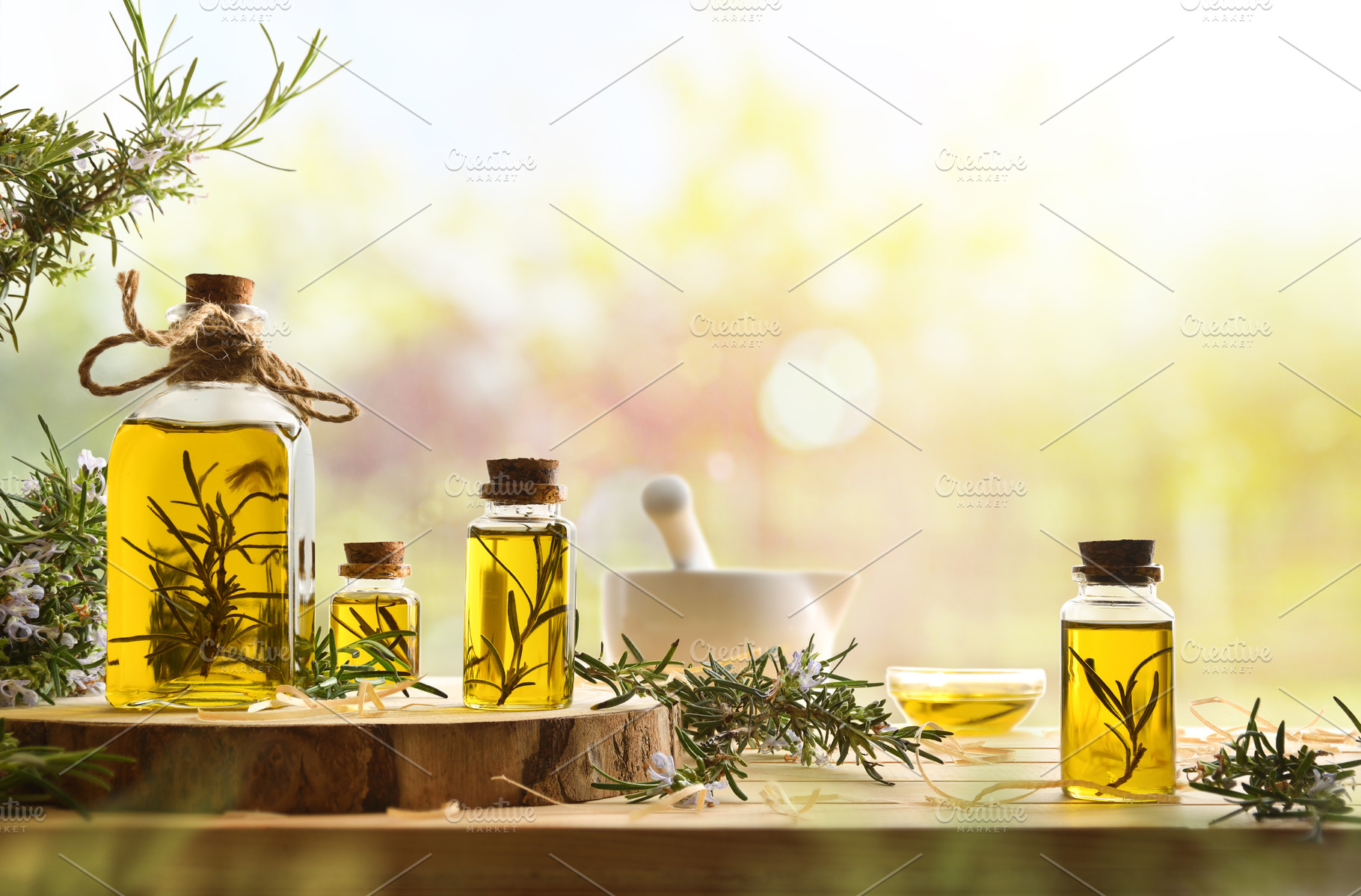 Homemade rosemary oil extract in glass jars in nature, a Health & Medical Photo by Davizro's Market
