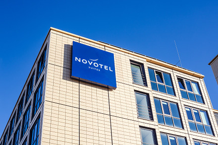 Novotel suites logo at hotel building in Munich, an Architecture Photo by Dvoevnore photos