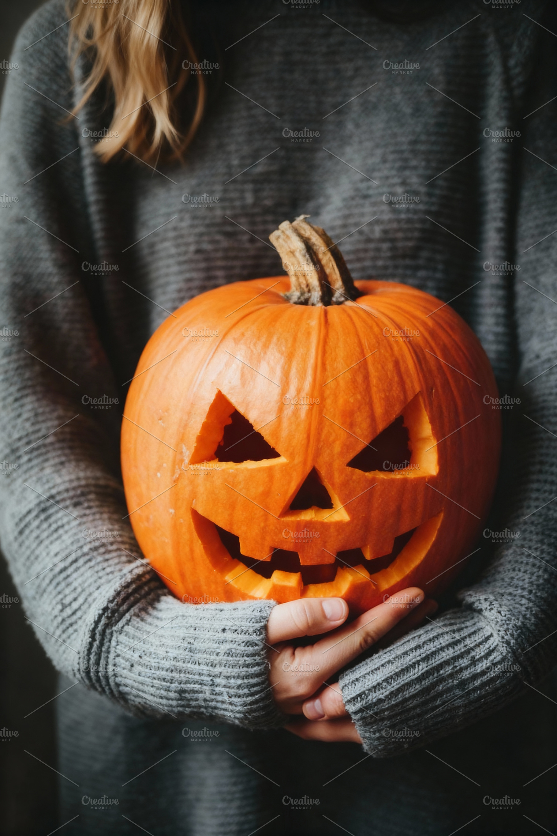 Hands Holding an Halloween Pumpkin, a Person Photo by Virgo Studio