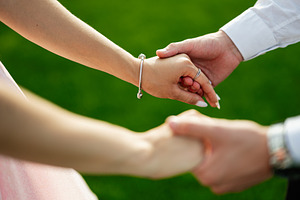 Close-up of couple holding hands with a romantic and emotional connection, a Photo by AS photostudio