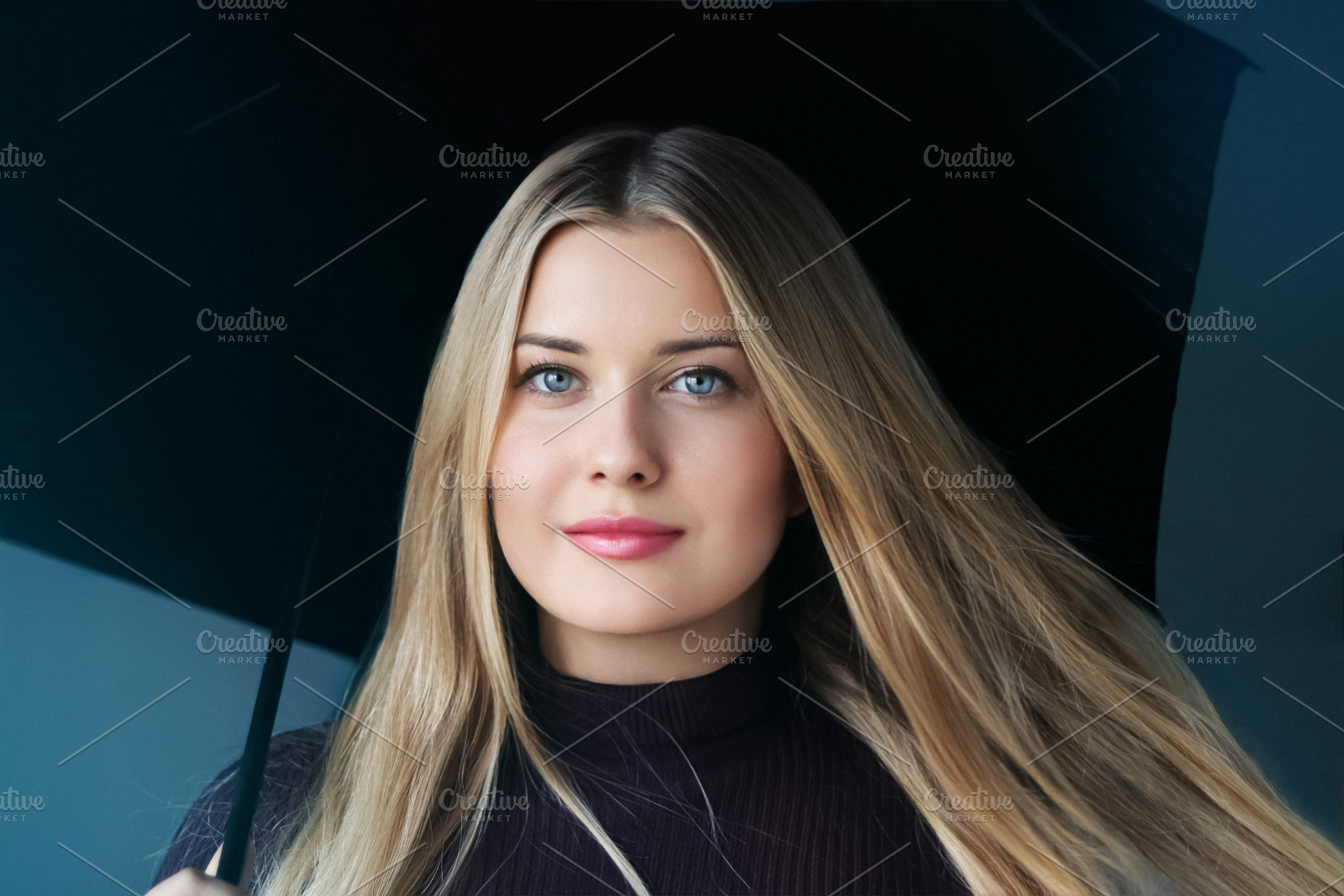 Young blonde woman with blue eyes holding a black umbrella, posi, a Person Photo by Studio ANNA