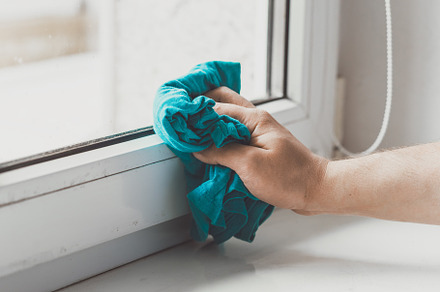 Man cleaning the windowsill, a Person Photo by Andriana Syvanych