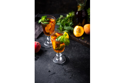 Cold ice tea with peach and mint, a Food & Drink Photo by Yulia Furman