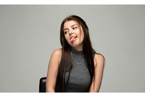 Young brunette woman making a funny, a Person Photo by volodymyrshtun13795