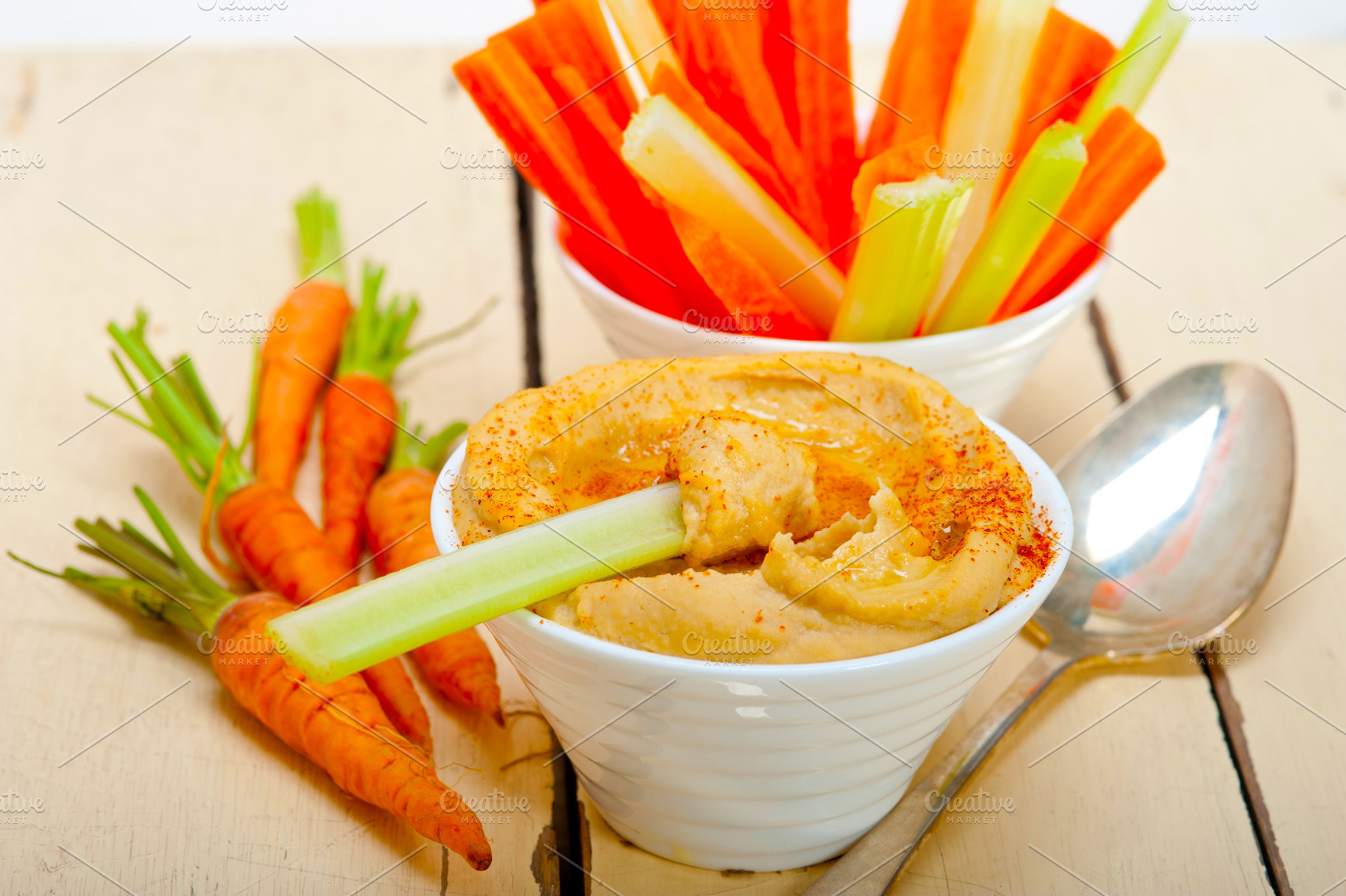 fresh hummus dip with raw carrot and celery, a Food & Drink Photo by keko64