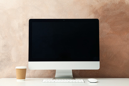 Workplace. Computer and cup of hot drink on white table, a Business Photo by AtlasStudio