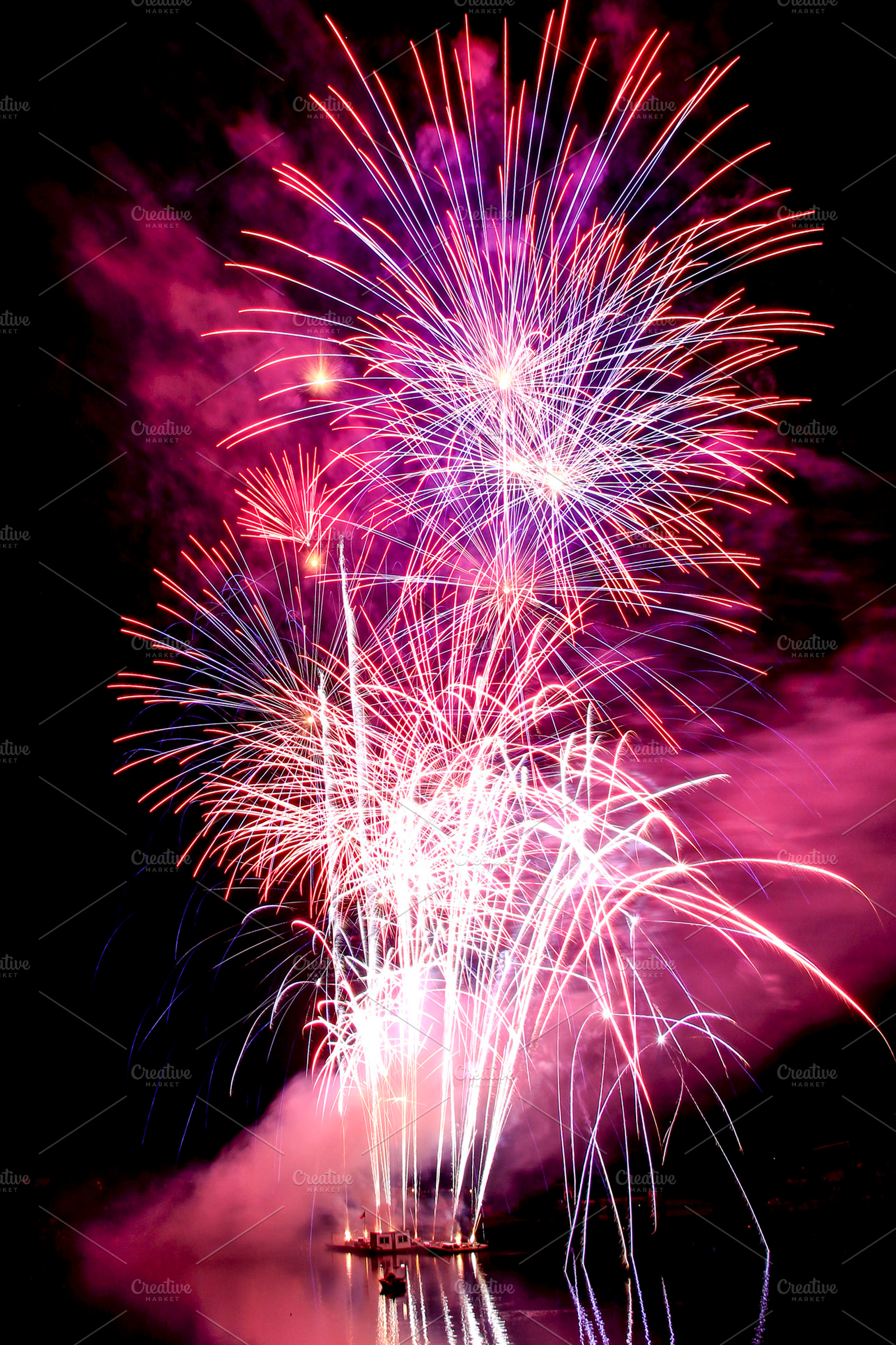 Fireworks over the water, a Holiday Photo by Tomas Luka