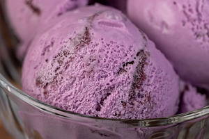 ice cream with blueberry flavor, blueberry ice cream balls, a Photo by rsoollAI
