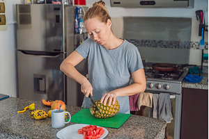 Woman preparing breakfast in a, a Food & Drink Photo by Elizaveta Galitskaya