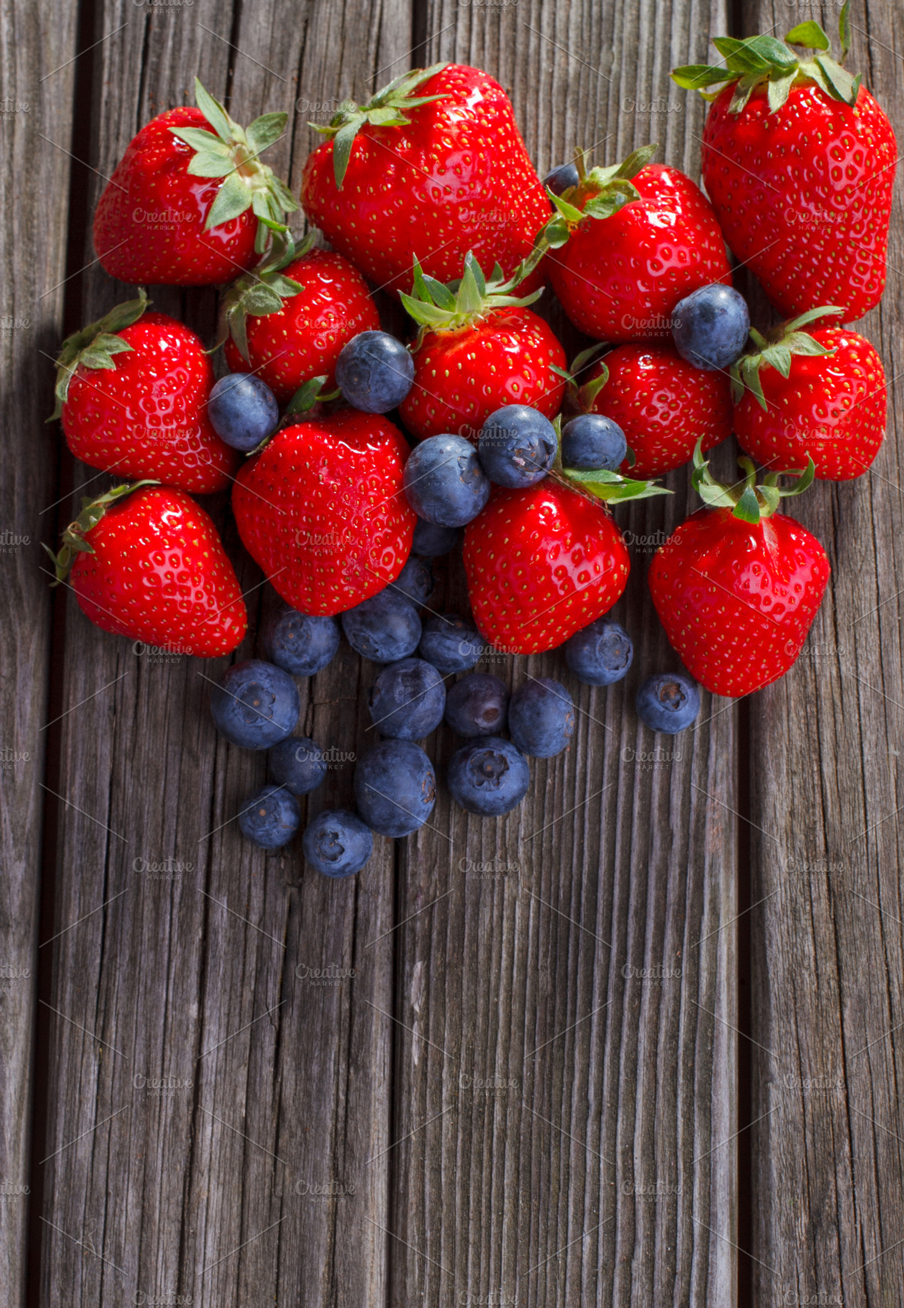 Mixed berries featuring berry, strawberry, and blueberry