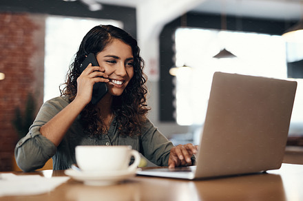 Her local cafe keeps her connected to productivity, a Photo by Peopleimages.com