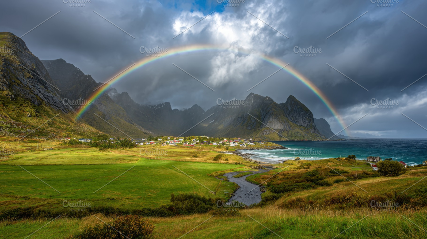 Rainbow over mountains and sea, a Photo by Beautiful things