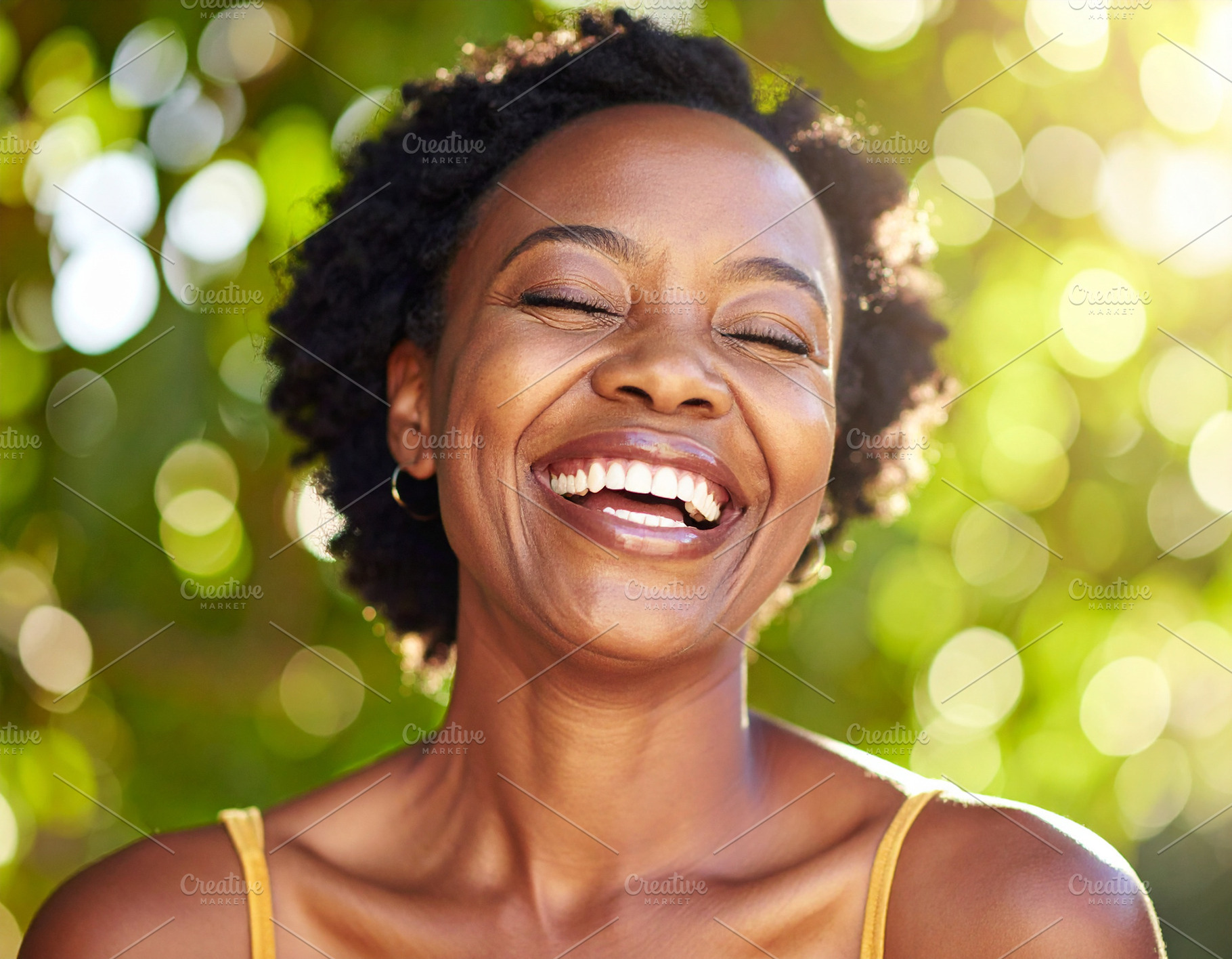 Adult woman laughing with her eyes closed, a Person Photo by DanFLCreativo