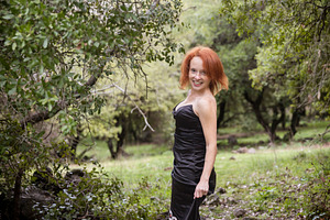 Red haired woman in a black dress an, a Person Photo by Imaginarium