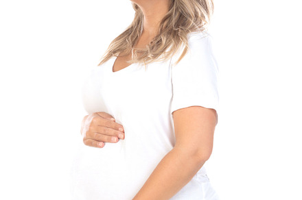 Young beautiful blonde woman pregnant expecting baby over isolat, a Person Photo by José Manuel Gelpi