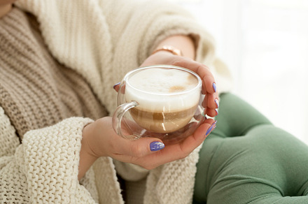 woman with a cup of hot drink