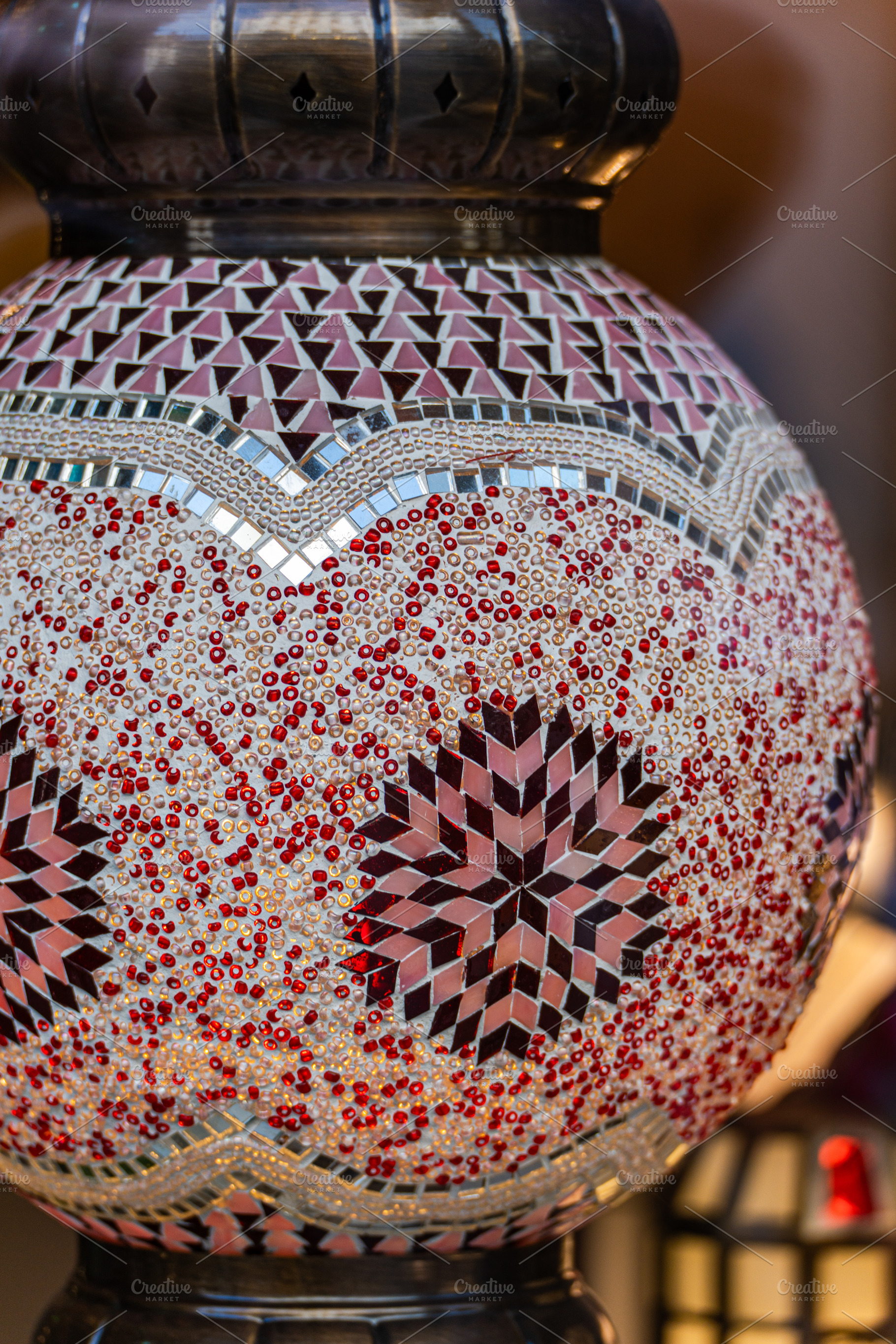 Close up of beautiful mosaic lamp, an Architecture Photo by Anna Bogush