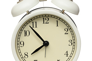 Classic white table alarm clock with two metal bells and a hamme, an Abstract Photo by ndanko