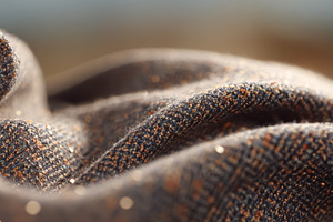 Woven textile fabric texture creating soft folds and shimmering, a Photo by Studio ANNA