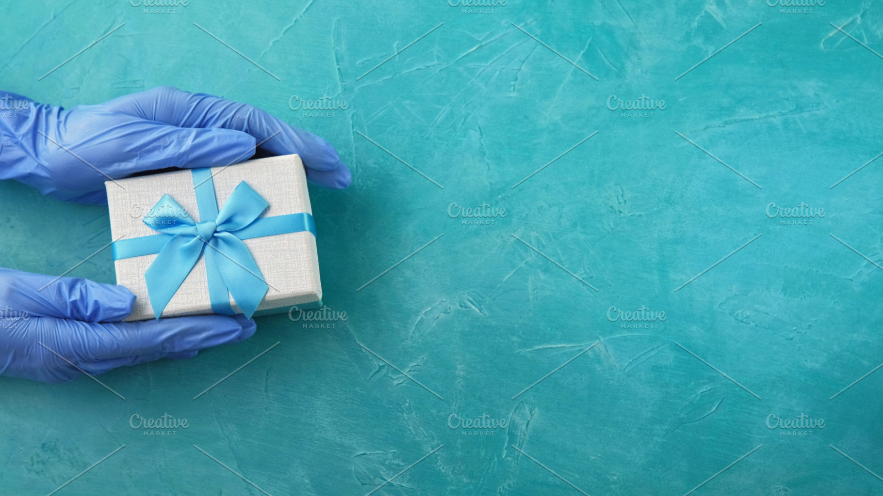 Gift delivery pandemic holidays hand glove box, a Person Photo by Photo Drive Studio