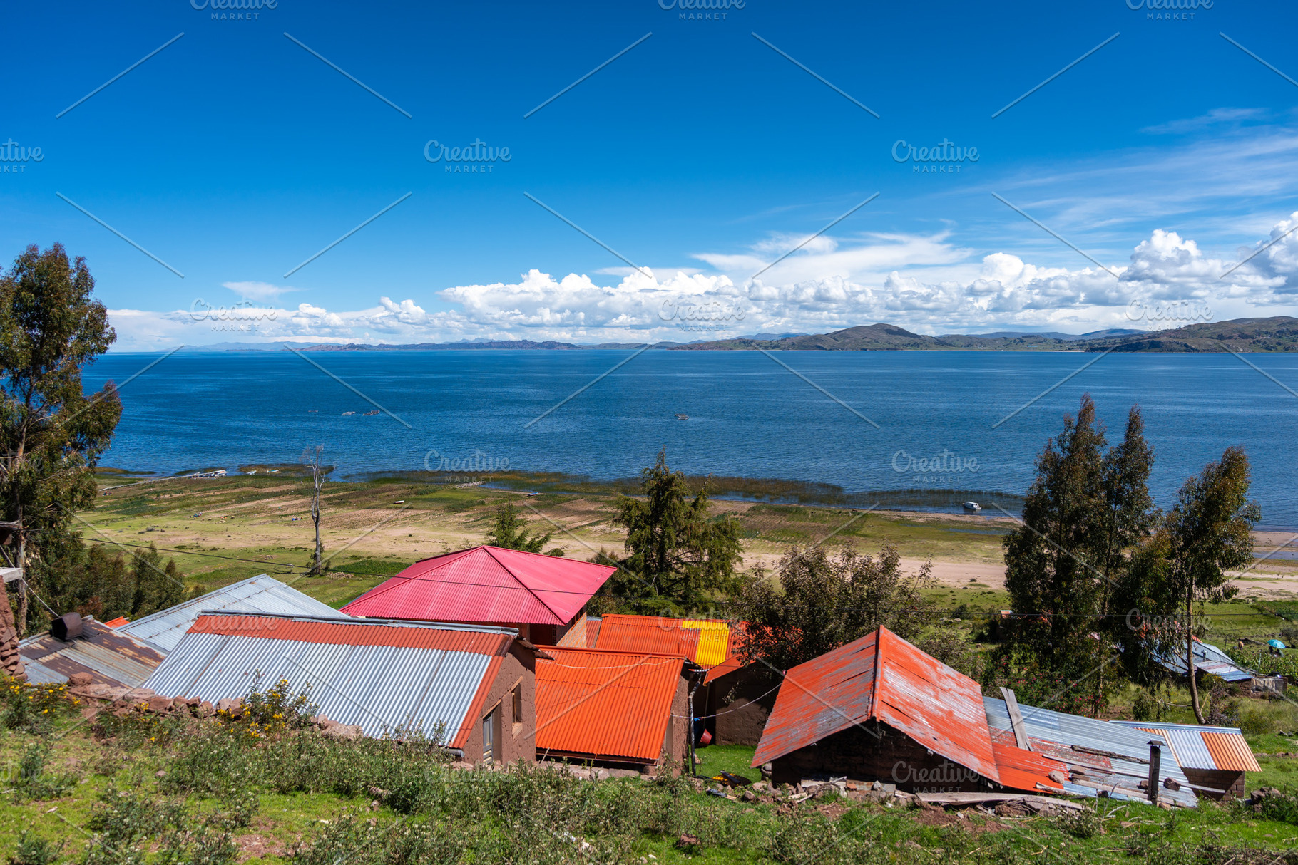 Scenic view of Lake Titicaca from Llachon with rural houses, an Architecture Photo by GoodGoods