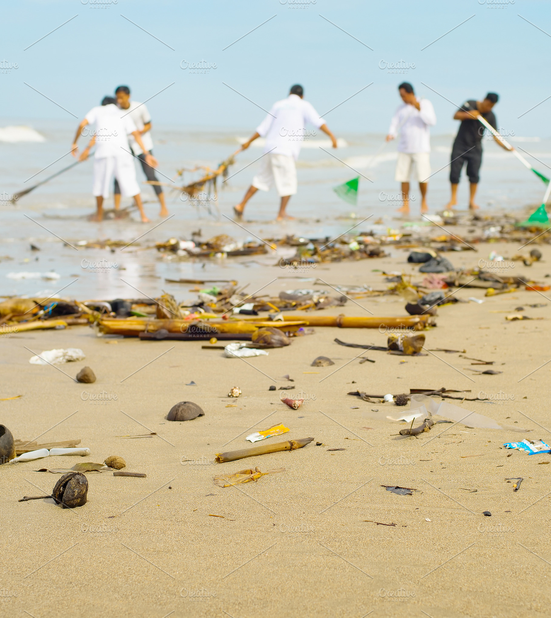 People cleaning garbage ocean beach stock photo containing beach and trash, a Person Photo by joyt