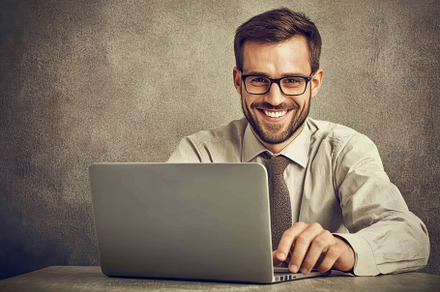 Professional man working on laptop w, a Photo by Tanuart