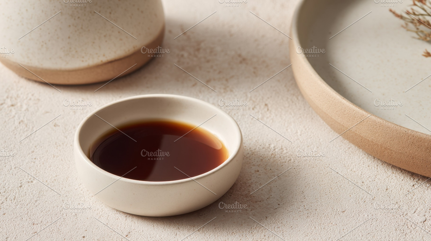 Bowl with dark liquid on a table, a Photo by Beautiful things