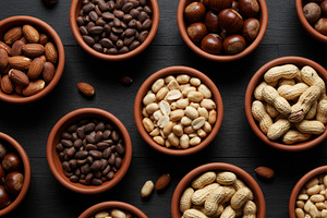 Various types of nuts in clay bowls, a Food & Drink Photo by professorinc
