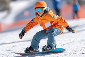 Child Snowboarding on a Sunny Winter Day, a Sports & Recreation Photo by AlyaAnd