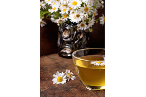 Chamomile Tea Cup with Fresh Daisy, a Food & Drink Photo by Natasha Breen
