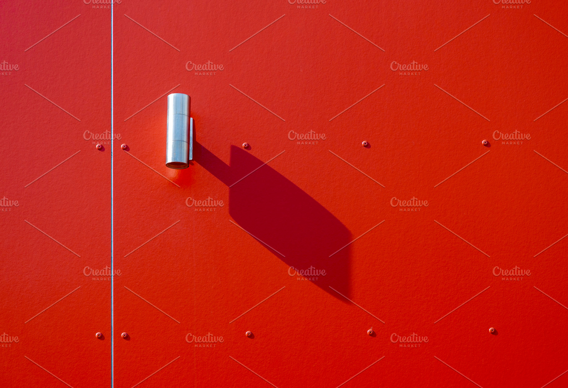 Outdoor lamp with shadow on red wall, an Architecture Photo by BOOCYS