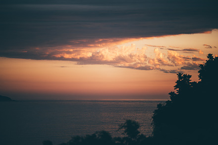 Dramatic sunset over the ocean, a Wallpaper Photo by SkyNext