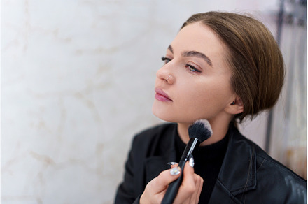 Close up portrait of a woman making, a Beauty & Fashion Photo by Iván Moreno STOCK PHOTO