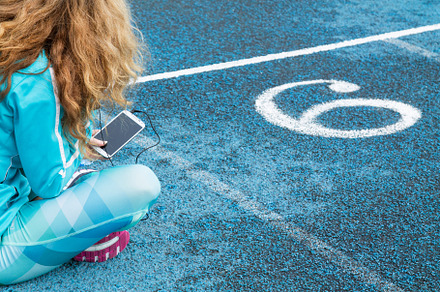 Female runner resting on the track w featuring cellphone, sport, and lifestyle